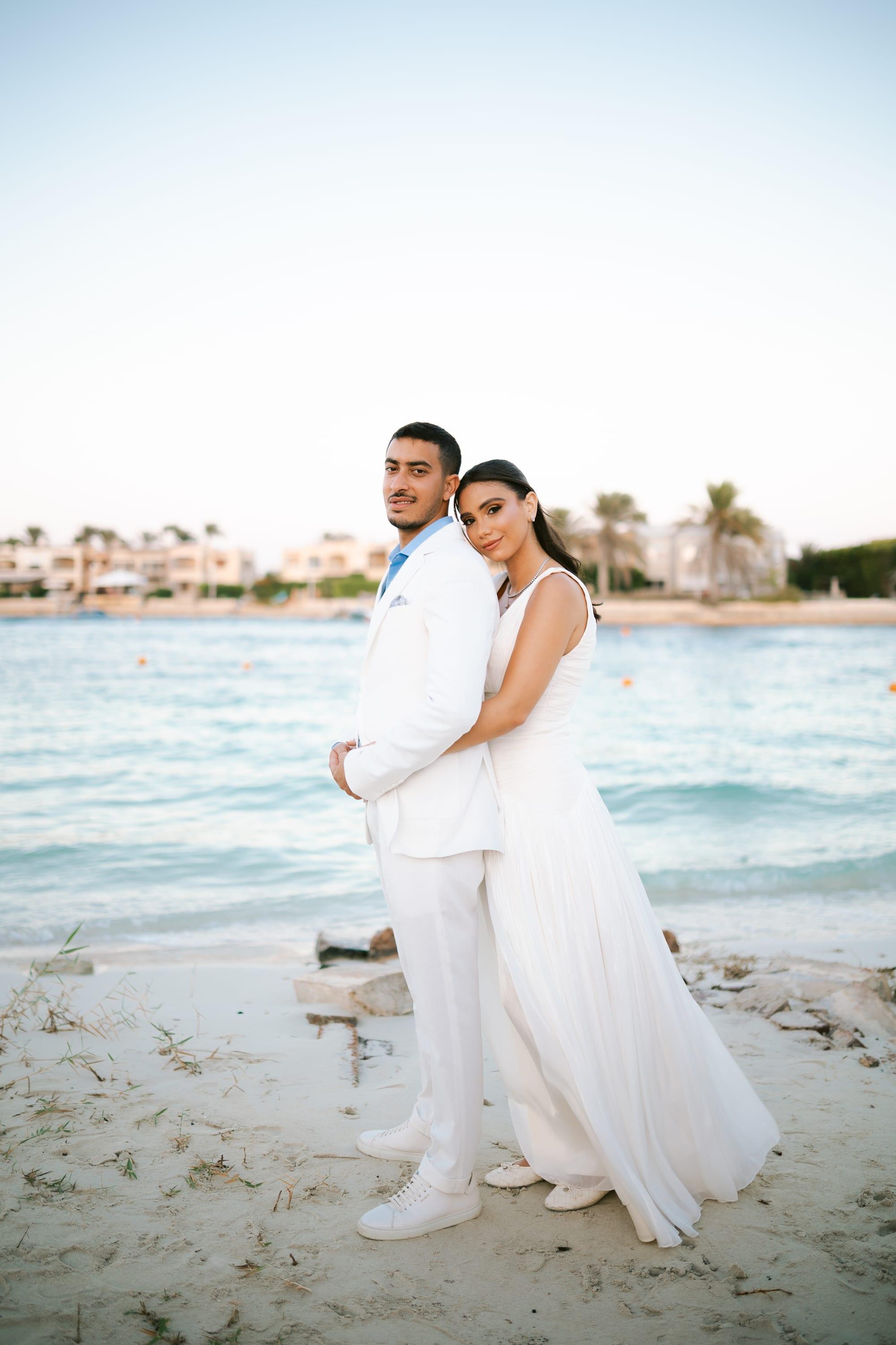 By the sea — Quiet vows, by the sea.